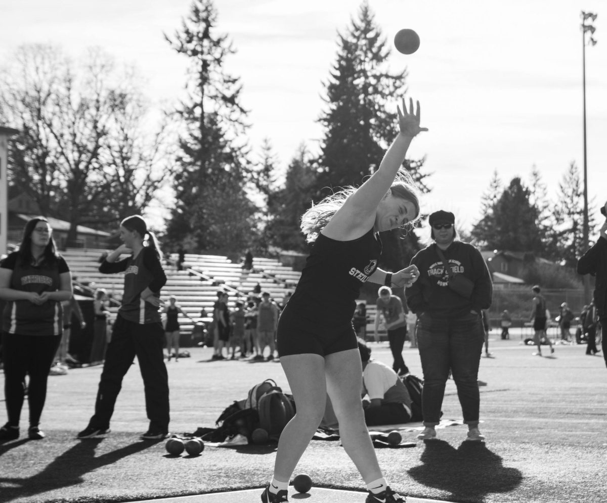 Freshman Kyra Anderson throwing shotput, another track event in which she holds a freshman record.