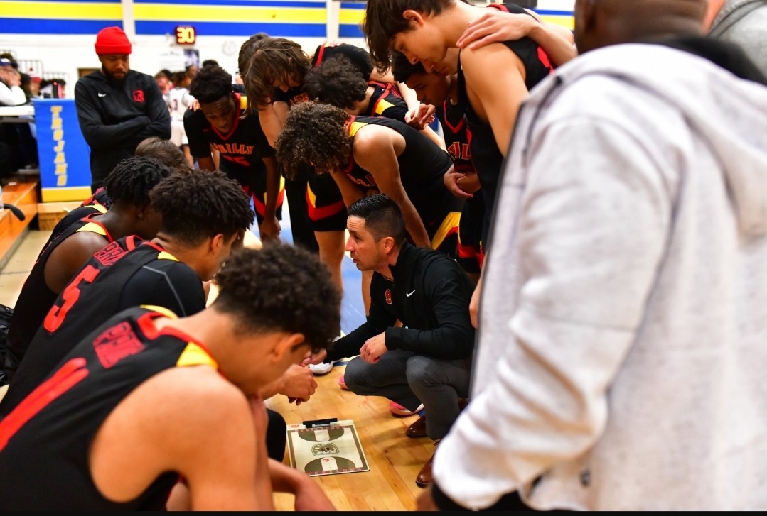 Coach Matt Robles connects with the 2022 Steilacoom team during a timeout. In this game against Lakes High School during the McCrossin tournament, Steilacoom ended up winning the game. Robles will now coach the Lakes Lancers this fall in a full-circle moment.
