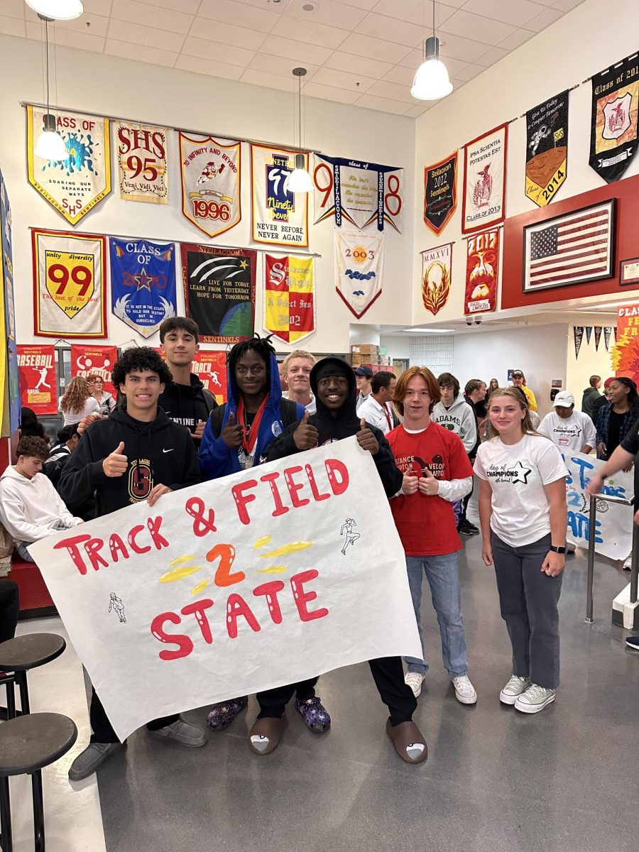 Track and Field are celebrated during the morning State surrounded by their coaches, the student body and the SHS band playing in celebration.