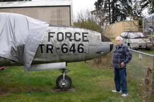 Glen Spieth stands next to his T-33 in his backyard.
